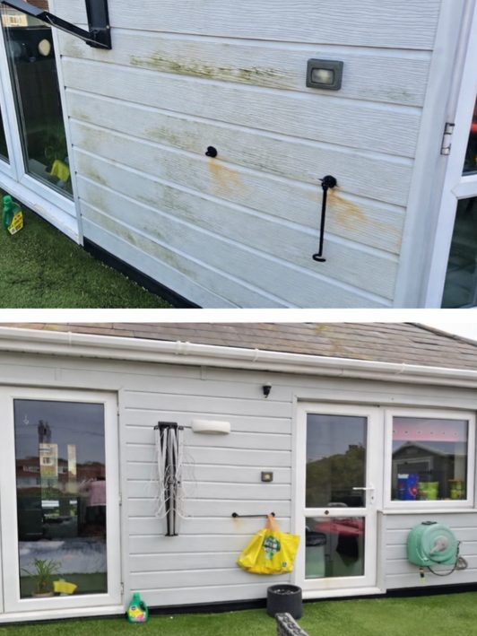 White PVC cladding covered in green algae before cleaning.