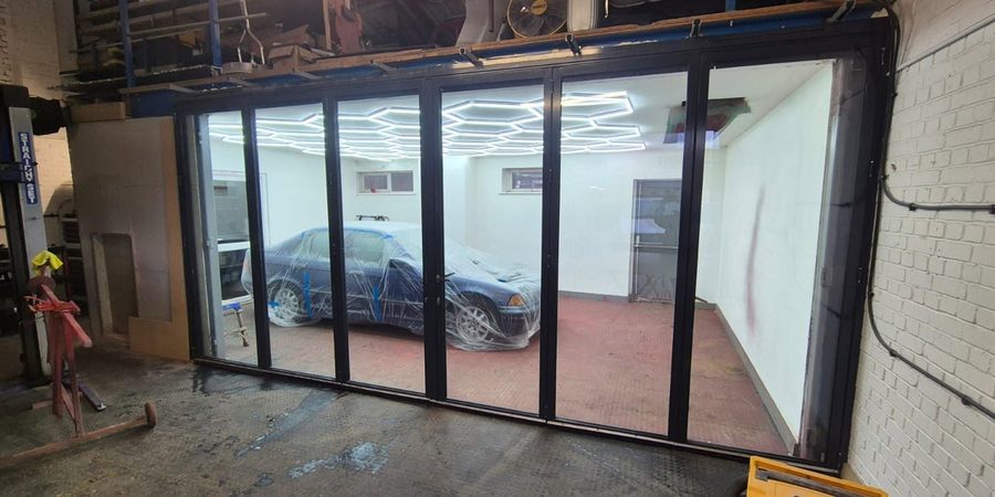 Bifold glazing inside a workshop.